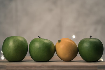 still life with fresh apples and lemons with lights in the background
