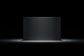 Isolated black realistic cardboard box on black background. 3d rendering.
