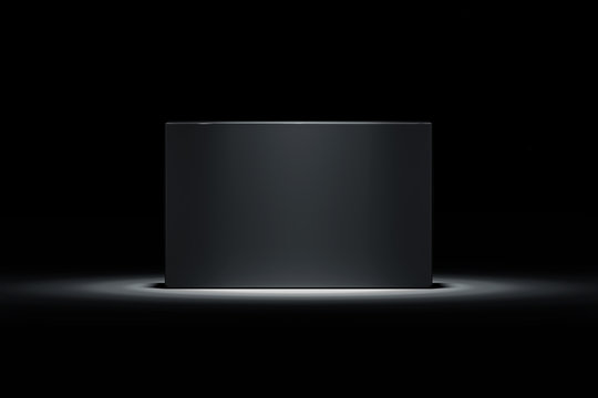 Isolated black realistic cardboard box on black background. 3d rendering.