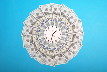Concept of clock and dollar. Clock on mandala kaleidoscope from money. Abstract money background...