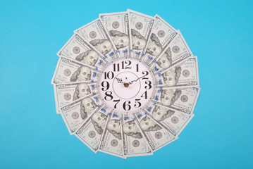 Concept of clock and dollar. Clock on mandala kaleidoscope from money. Abstract money background...