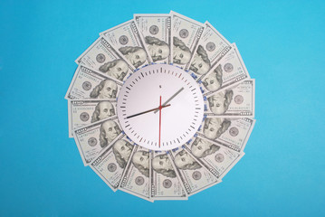 Concept of clock and dollar. Clock on mandala kaleidoscope from money. Abstract money background...