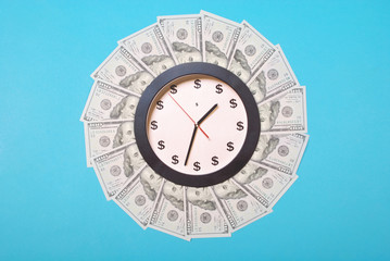 Concept of clock and dollar. Clock on mandala kaleidoscope from money. Abstract money background...