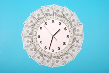 Concept of clock and dollar. Clock on mandala kaleidoscope from money. Abstract money background...