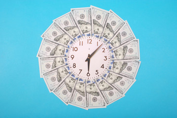 Concept of clock and dollar. Clock on mandala kaleidoscope from money. Abstract money background...