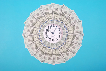 Concept of clock and dollar. Clock on mandala kaleidoscope from money. Abstract money background...