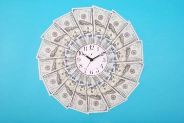 Concept of clock and dollar. Clock on mandala kaleidoscope from money. Abstract money background...