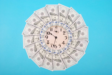 Concept of clock and dollar. Clock on mandala kaleidoscope from money. Abstract money background...