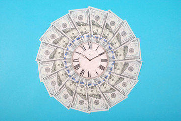 Concept of clock and dollar. Clock on mandala kaleidoscope from money. Abstract money background...
