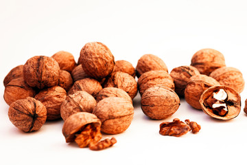 Whole walnuts kernels on white background.