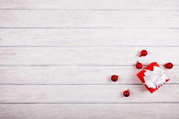 Gift box with christmas decoration on wood desk