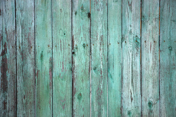 Fototapeta na wymiar The old wooden walls painted green. Old wooden wall background or texture.