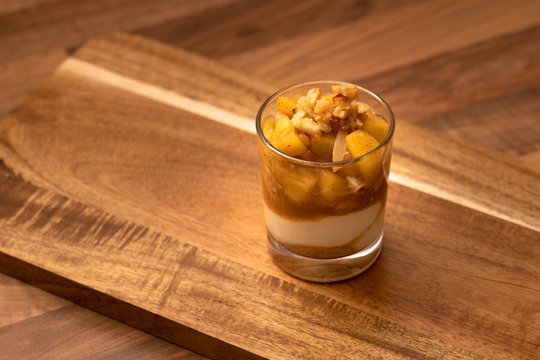 Apple dessert on wooden board and table