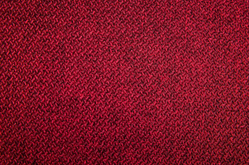 Textured background surface of textile upholstery furniture close-up. red Color fabric structure