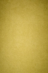 Textured background surface of textile upholstery furniture close-up. yellow Color fabric structure