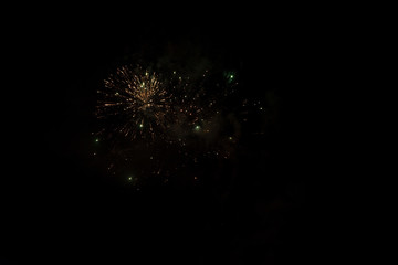Fototapeta premium fireworks and smoke on the background of the night, misty sky