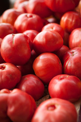 Fototapeta na wymiar TOMATO RASPBERRY OXHEART - pink tomato variety, incredibly tasty flavour on the farm shop market for sale.