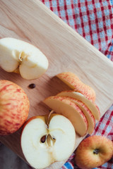 Sliced of apple on wooden board