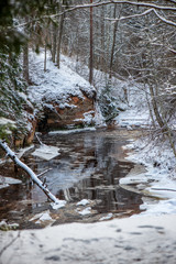 frozen ice and snow in river in winter