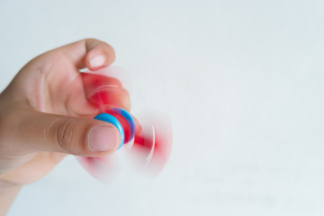 Child hold the spinner toy