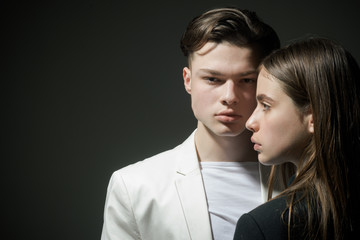 Fashion couple in love. Beauty and fashion. Man and woman. Hair style and skincare. Friendship relations. Family bonds. fashion is our life. man and woman on black background, copy space