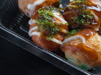 Takoyaki in plastic tray