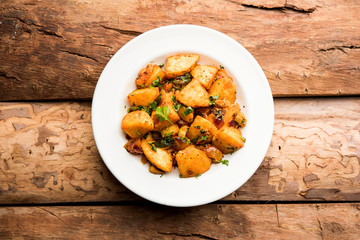 Masala fried Idlies or Idli fry - south indian Snack made using with leftover idly served with tomato ketchup. selective focus
