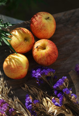 Apple on wooden board