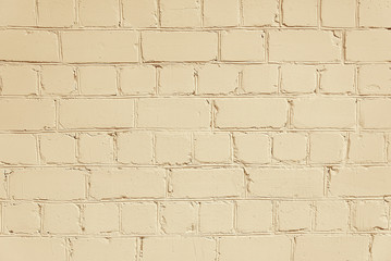 Fototapeta premium Old beige brick wall background texture