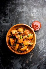 Masala fried Idlies or Idli fry - south indian Snack made using with leftover idly served with...
