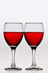 glass of red wine on white background