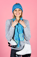 Sport, activity, health, lifestyle. Girl with figure skates. Smiling woman with ice skates enjoying...