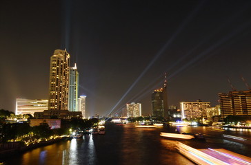building near river in night of Bangkok Thailand