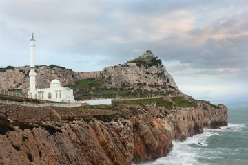 Landscape of shore with Mosque and famous The rock of Gibraltar