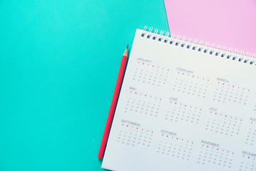 close up of calendar and pencil on the table, planning for business meeting or travel planning concept