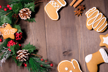 ginger biscuit  on brown wood background with Christmas tree 