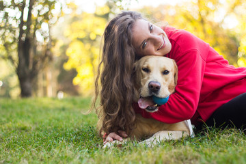 Young smiling woman with her cute dog