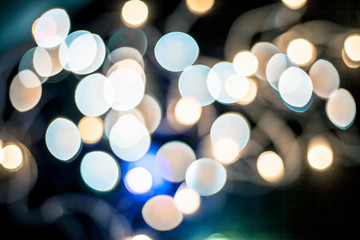 Colorful Christmas lights and blurred background or bookeh of them.;