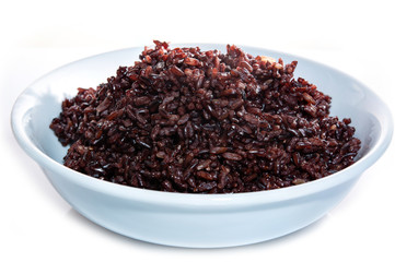 Brown rice, riceberry organic food  in white bowl Isolated and white background