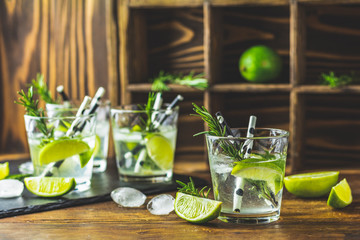 Fresh cocktail with lime, ice and rosemary, mojito cocktail