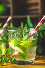Mojito, fresh alcoholic cocktail with lime, ice and mint