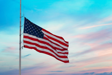 American flag on the sunset sky background