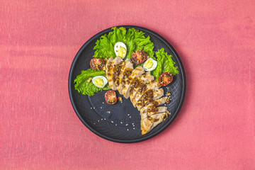 Chicken with honey and mustard souse, lettuce, quail eggs, cherry tomatoes