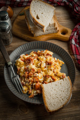 Scrambled eggs with sausage.