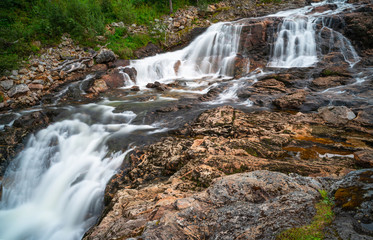 Fototapeta premium A small waterfall near Ersfjorden in Norway