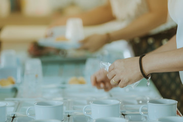 Woman prepare snack and beverage for conference lunch break
