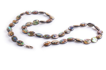 Naklejka premium colored nacre beads isolated on white background