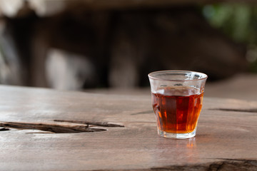 A cup of tea on wooden desk