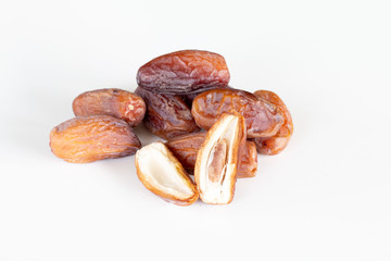 Close up of dried dates palm fruits on white background