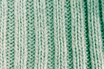 light green cotton knitted fabric texture background. toned image